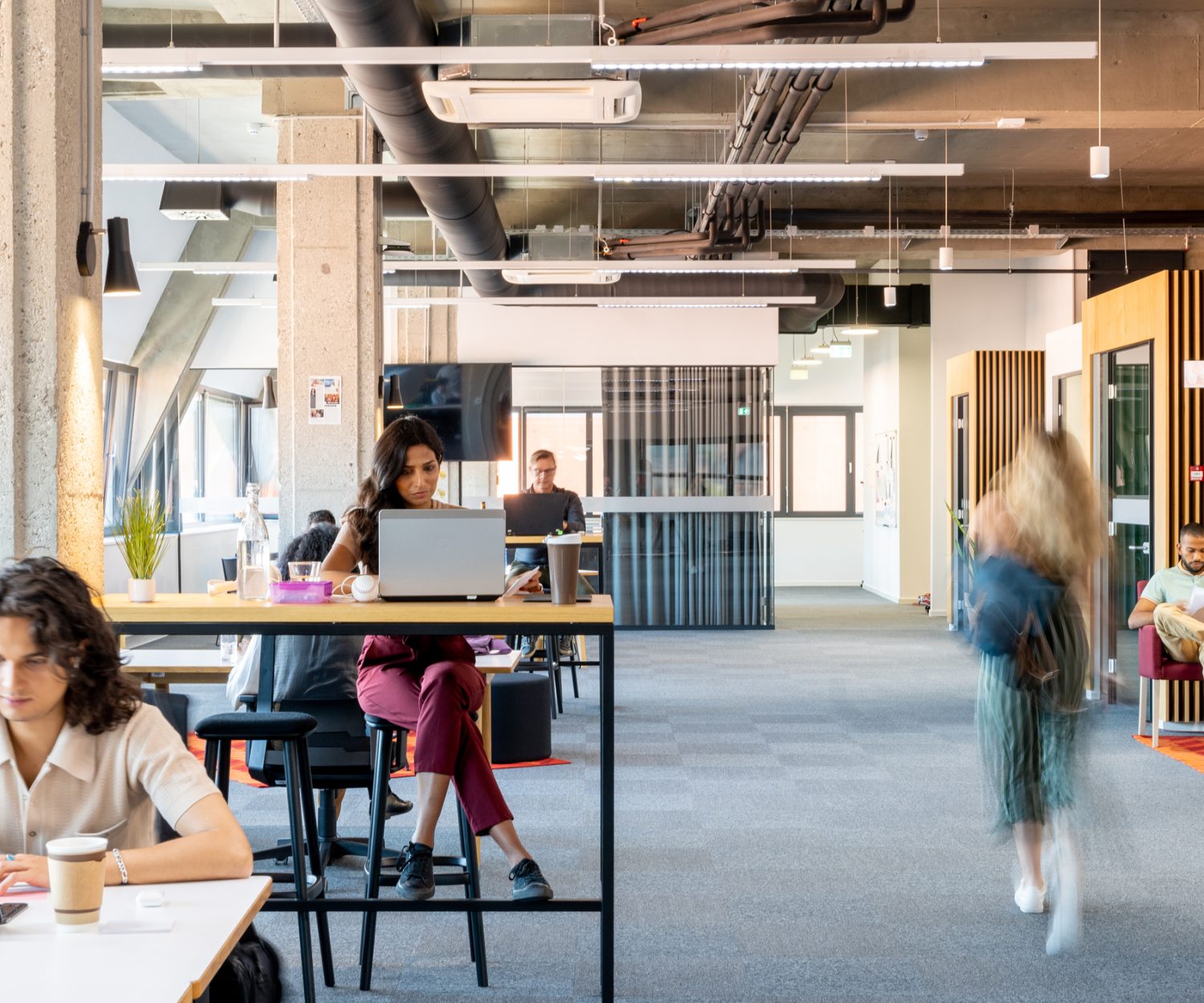 Business people using laptop and digital tablet in office.